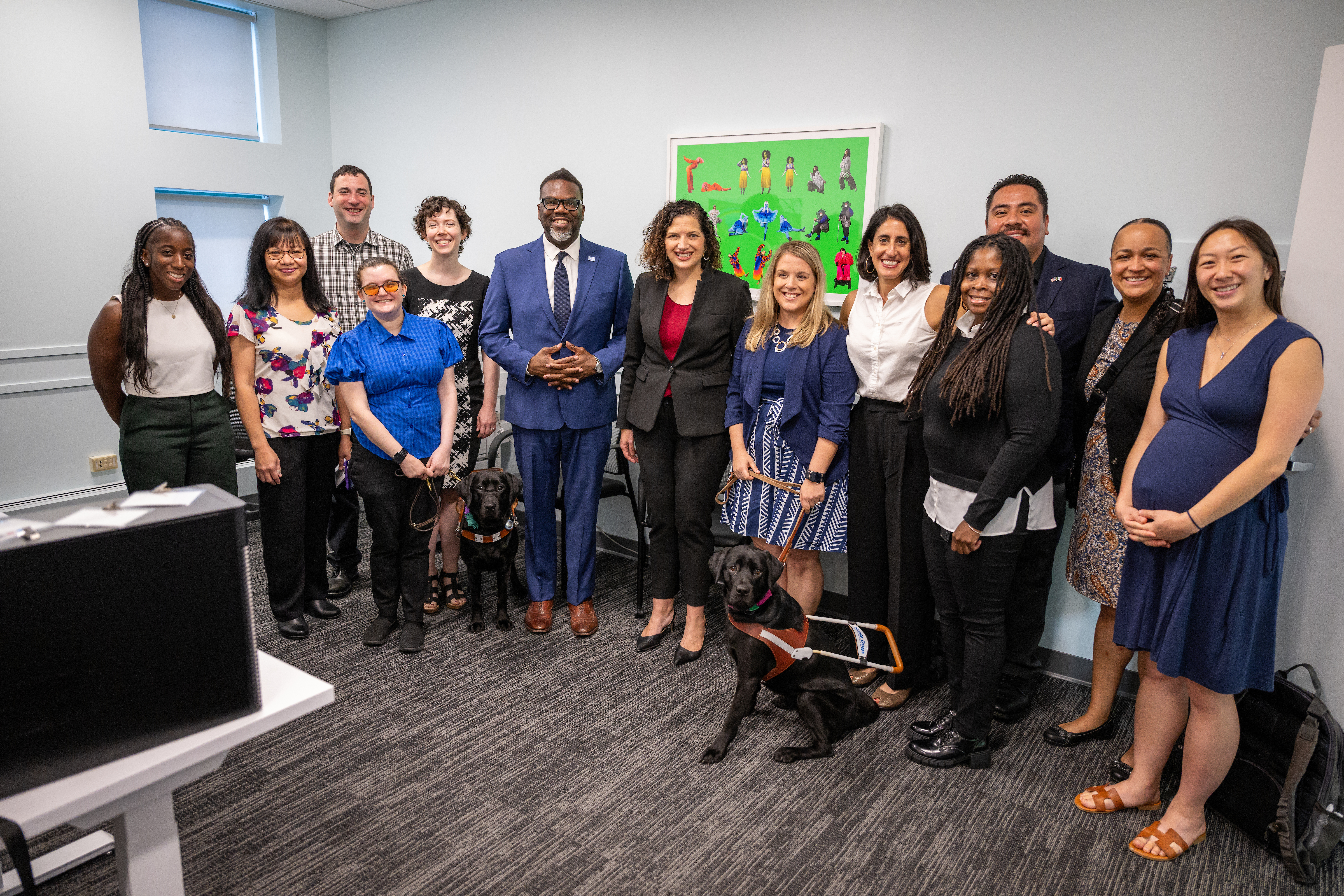 Career Center staff pose with Mayor Brandon Johnson (center, in a blue suit) in 2023. 